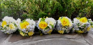 Yellow rose and blue hydrangea bridesmaids bouquets