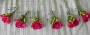 Pink Alstromeria and green berry boutonnieres