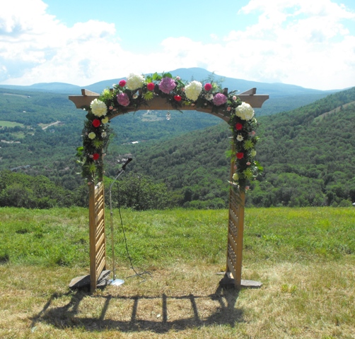pink white and green floral arch