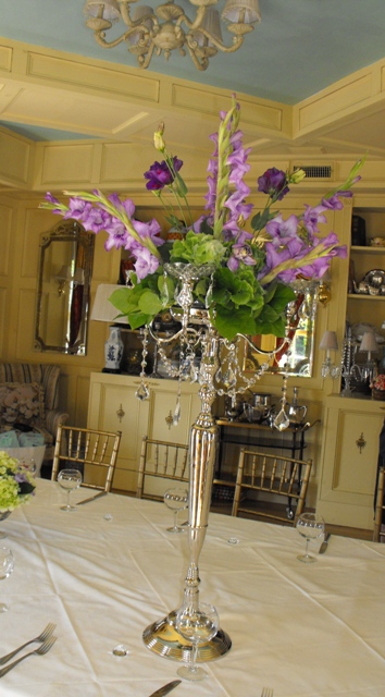 candelabra arr with greens and purples