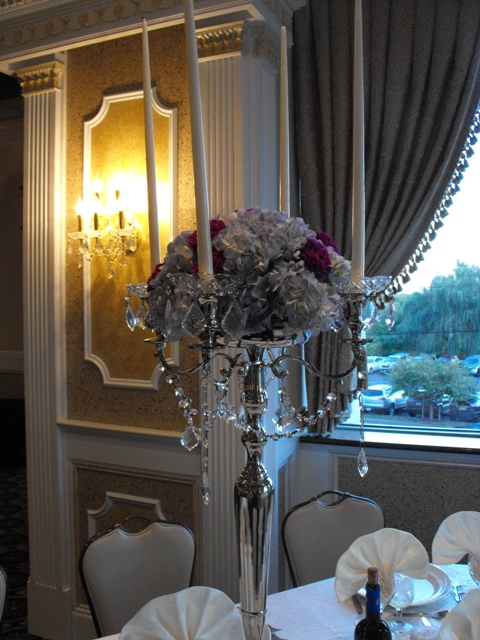 Tall candelabra with hydrangea and carnations