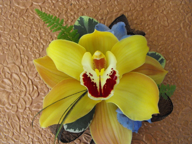 yellow orchid delphinium corsage